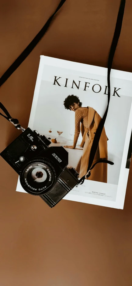 an image of a magazine and camera hanging