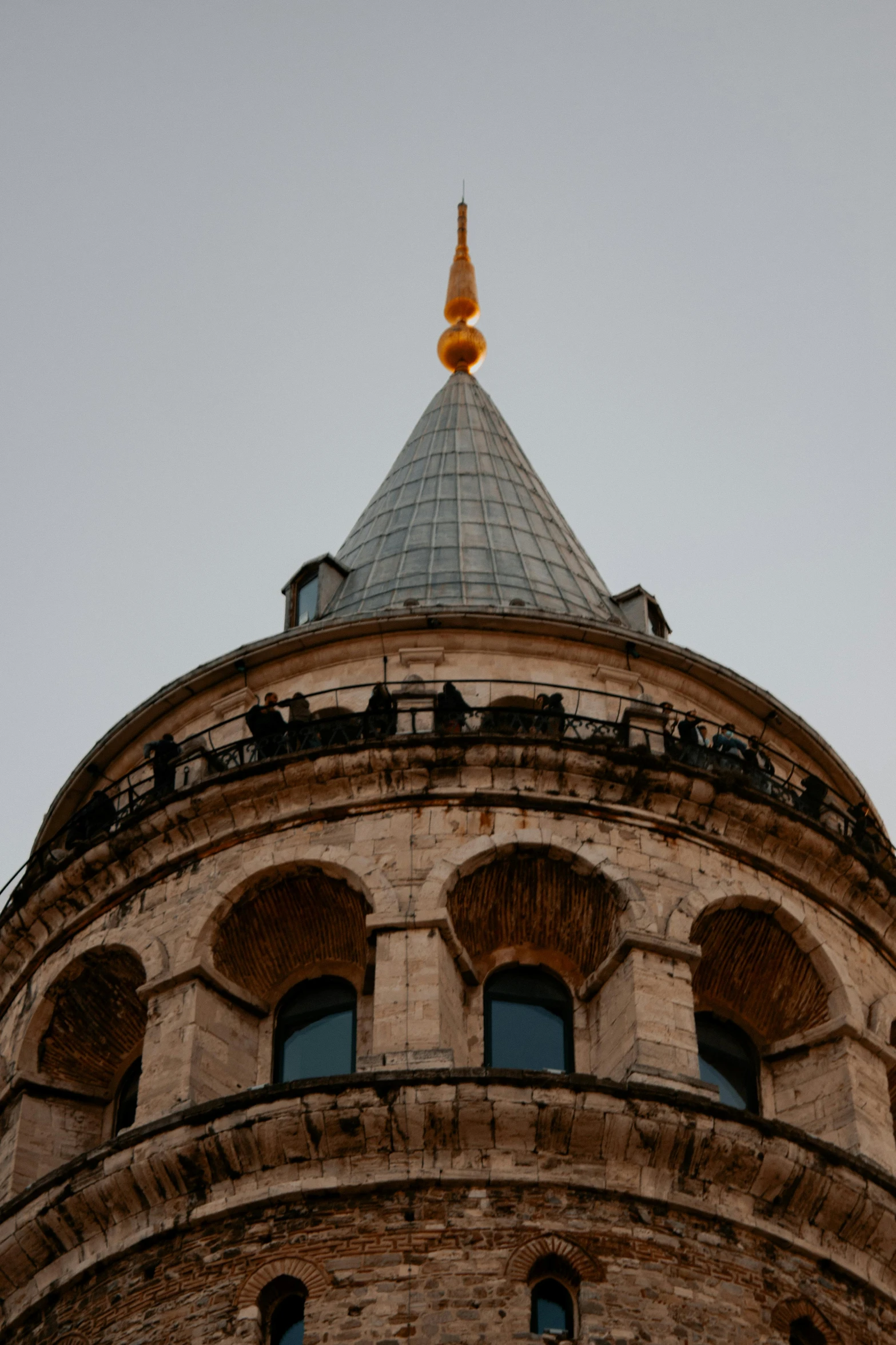 the top of an old stone building with circular windows