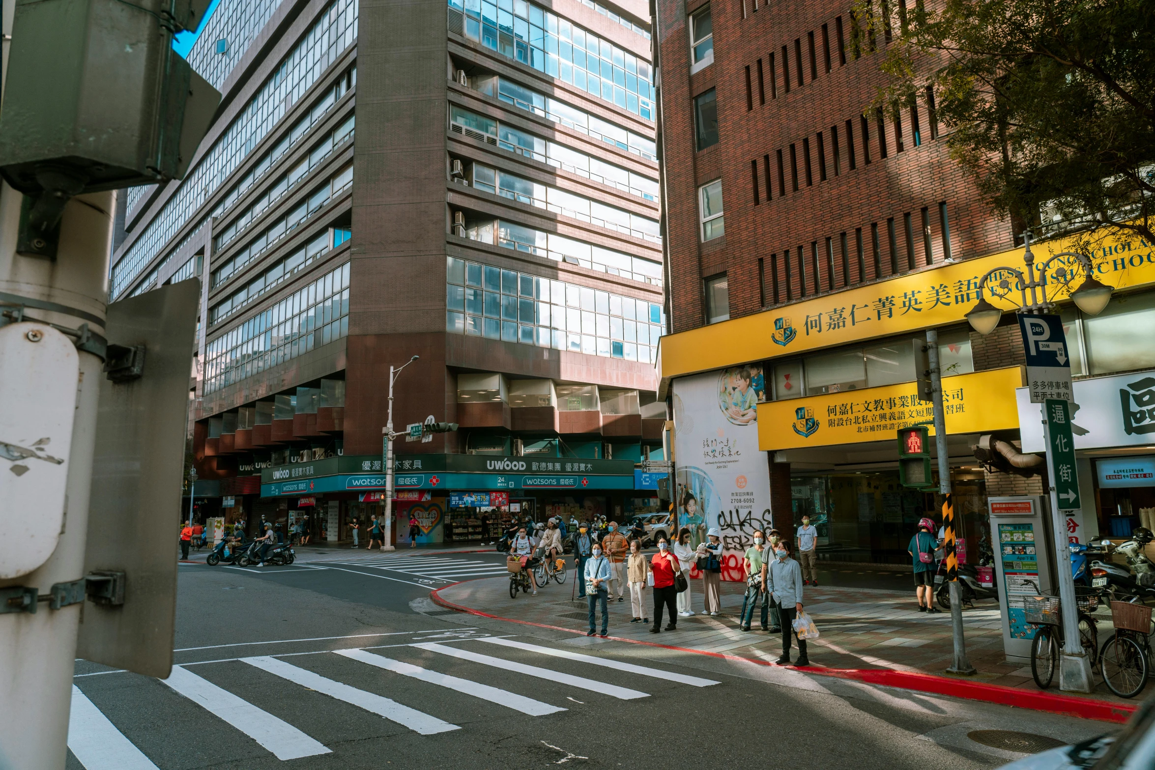 people crossing the street in an asian city