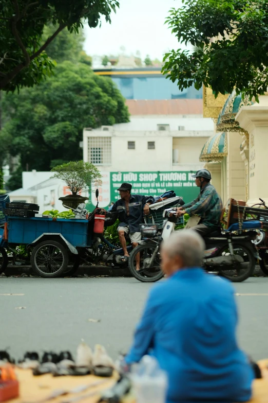 the people are in the street on their motorcycles