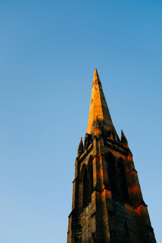 the top of a large stone tower with a clock on it