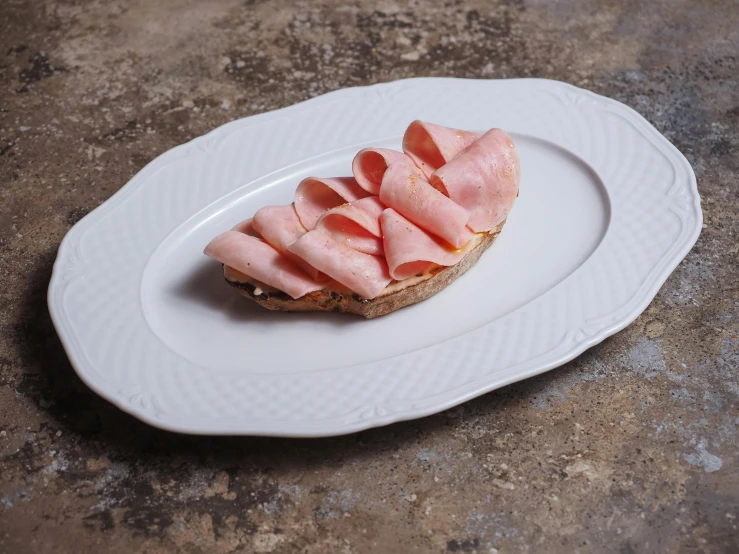 a close up of a sandwich on a plate on a table