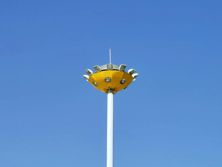 a very tall yellow object in the sky