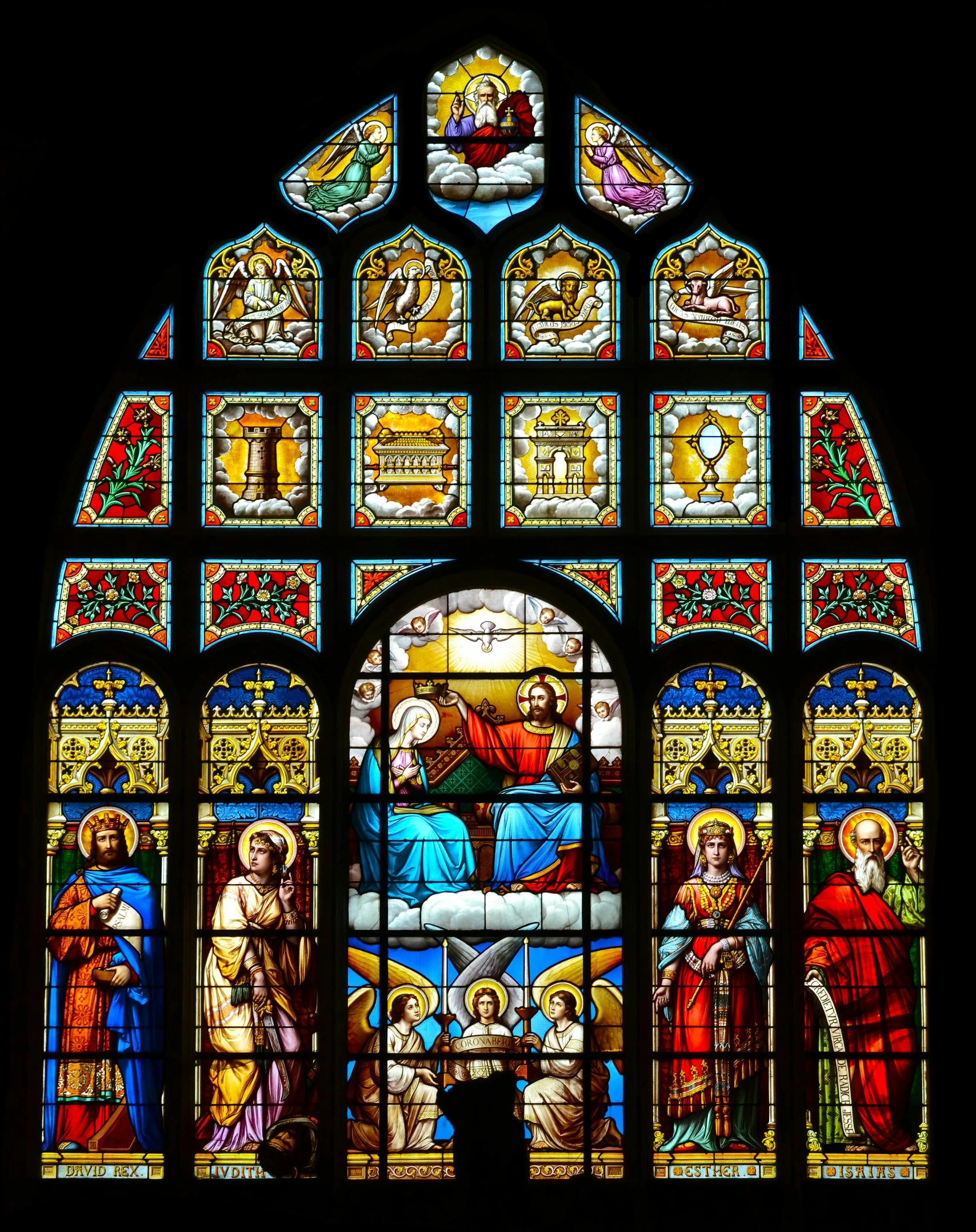 a close up of a stained glass window with jesus