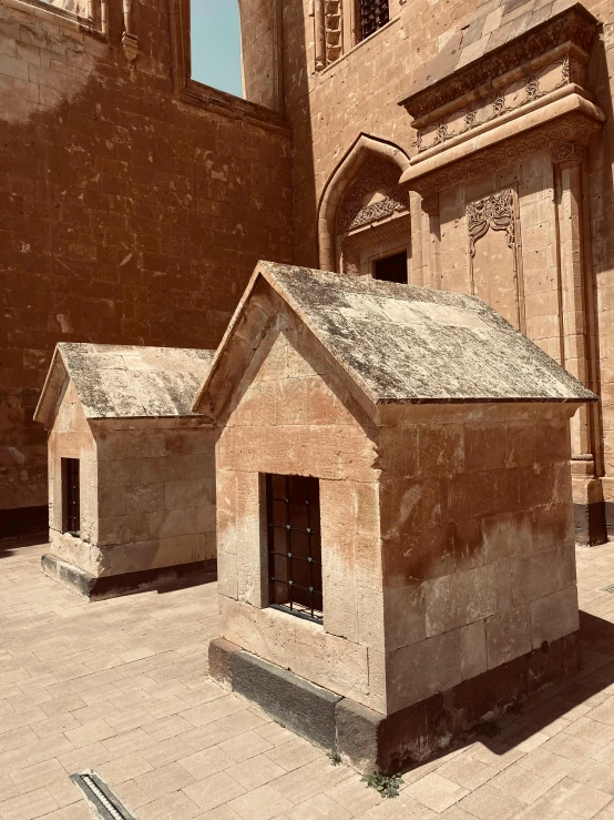 two old, weathered buildings next to each other