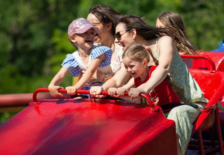 a group of s playing on a roller coaster