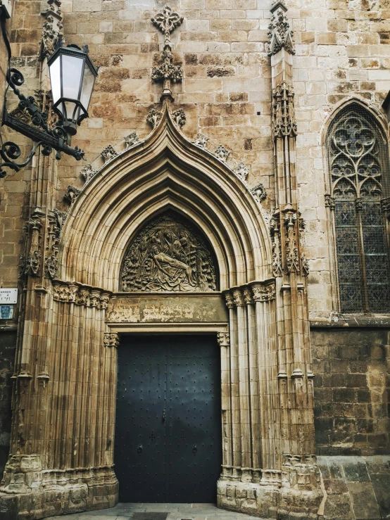 an old church entrance with a large black door