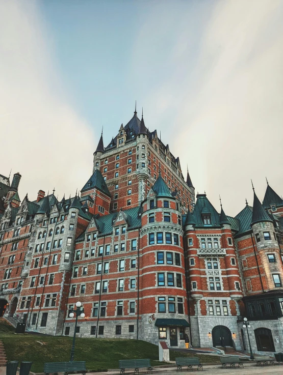 a group of tall buildings with blue roofs and windows