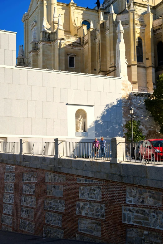 a couple of red motorcycles are parked outside a building