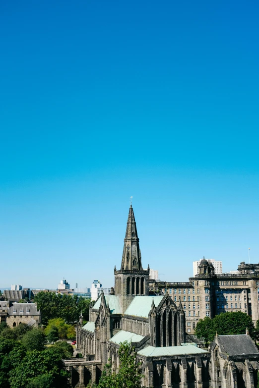 a large cathedral rises over the city skyline