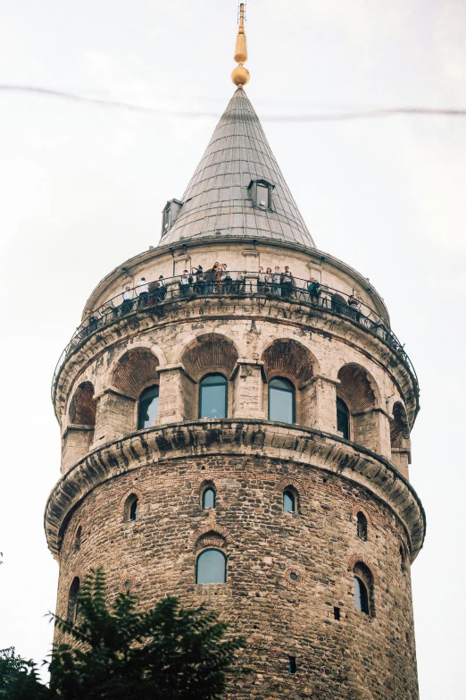 the top of an old tower structure on a cloudy day