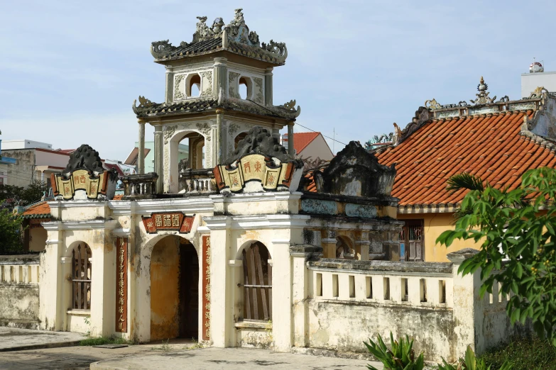 an old building with a tower and weather vane