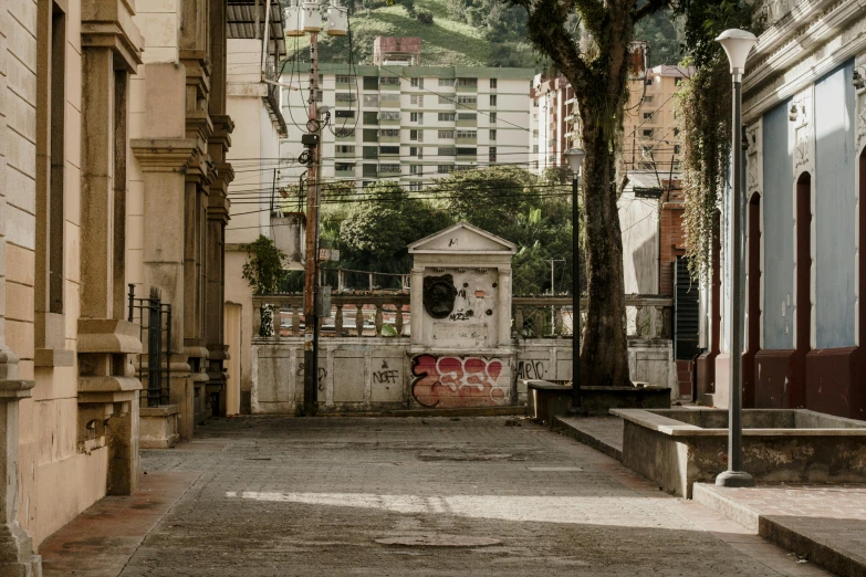 the empty city street has graffiti on it