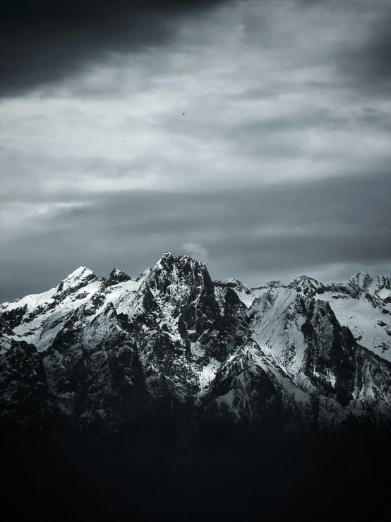 a mountain range that is shown in black and white