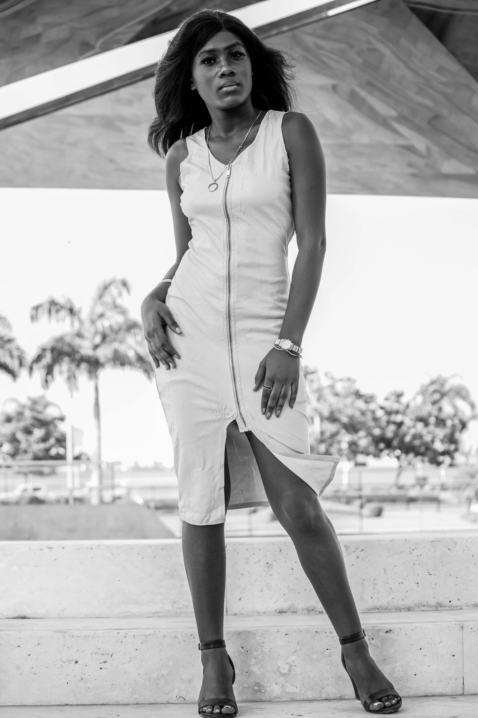 woman in white outfit with celet and heels