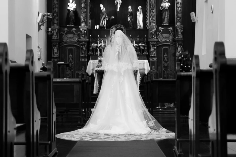 the back end of a bride and groom at a church