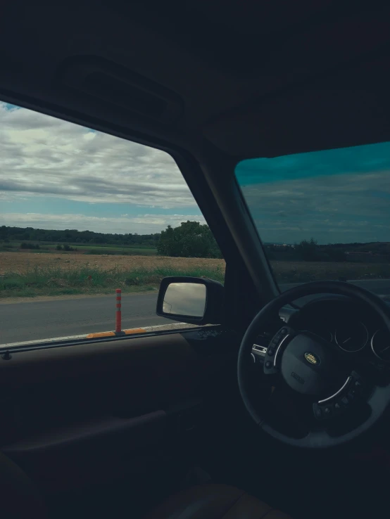 view out a car window looking into a countryside