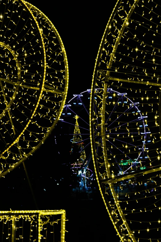 bright lights on different parts of an amut park at night