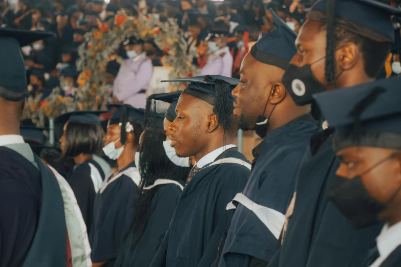 group of graduating students in cap and gowns