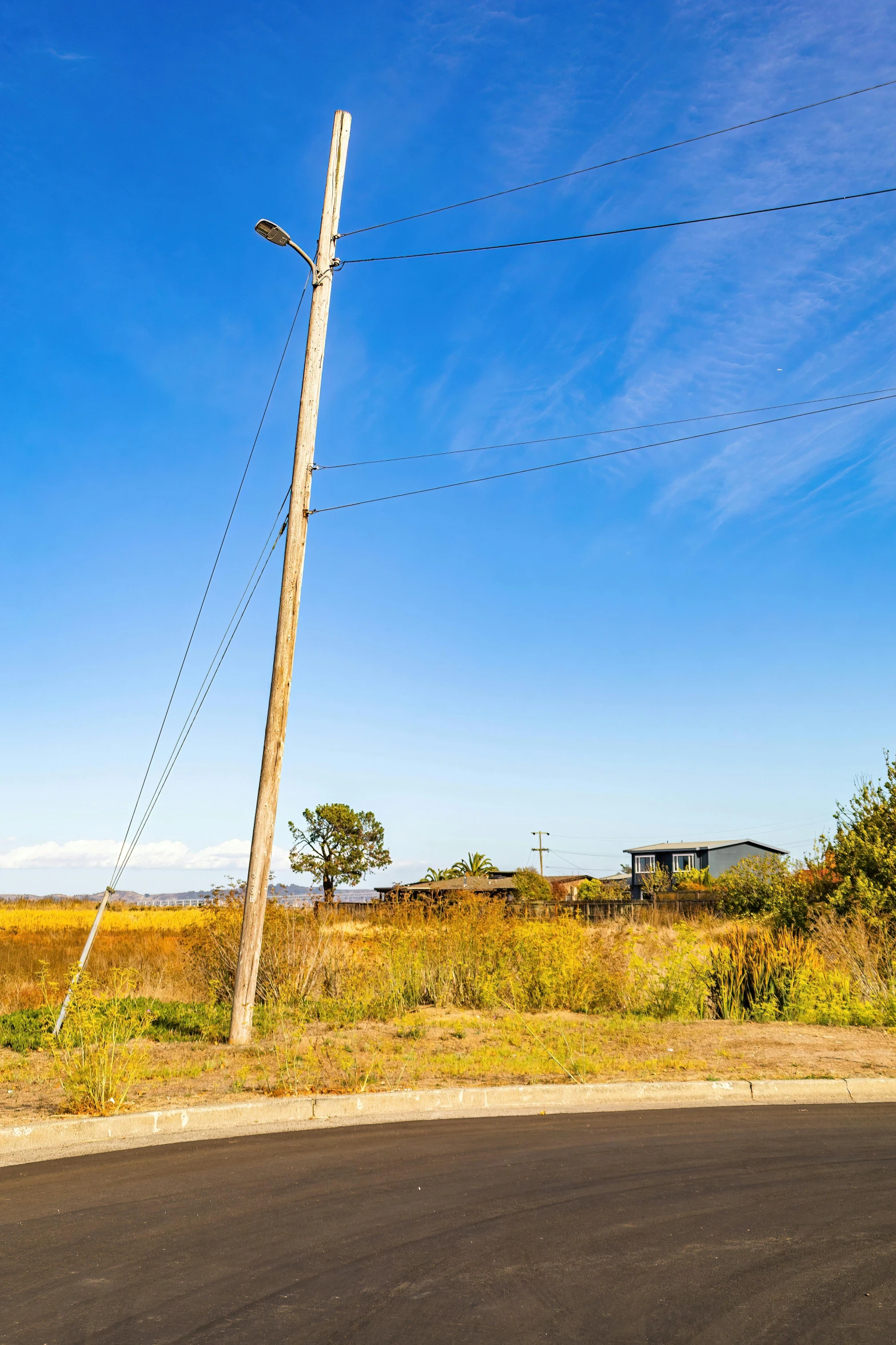 a pole that is next to some telephone wires