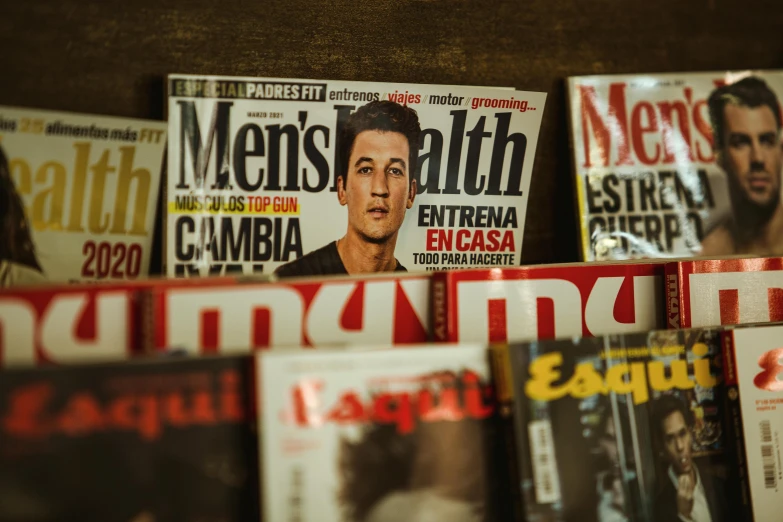 a lot of magazine's sitting on top of a counter