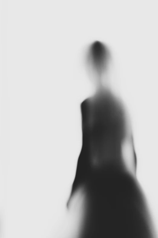 a blurry image of a person walking along side