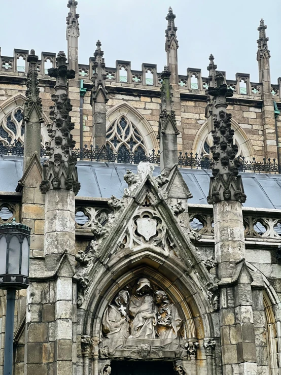 a stone church with ornate carvings in the roof and in the walls