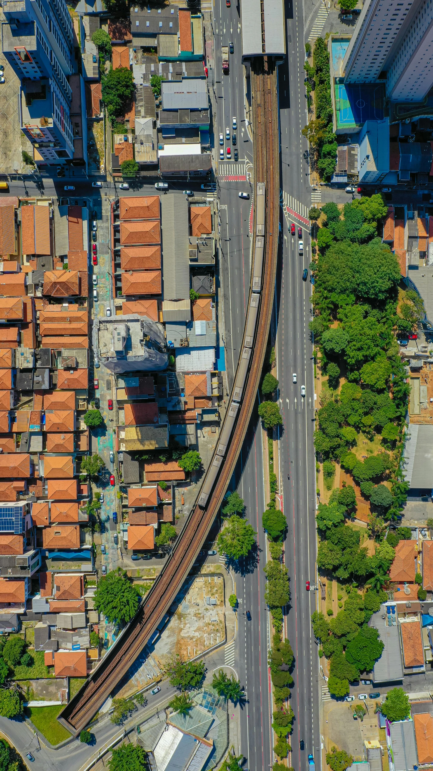 an overhead view of the train tracks and the streets