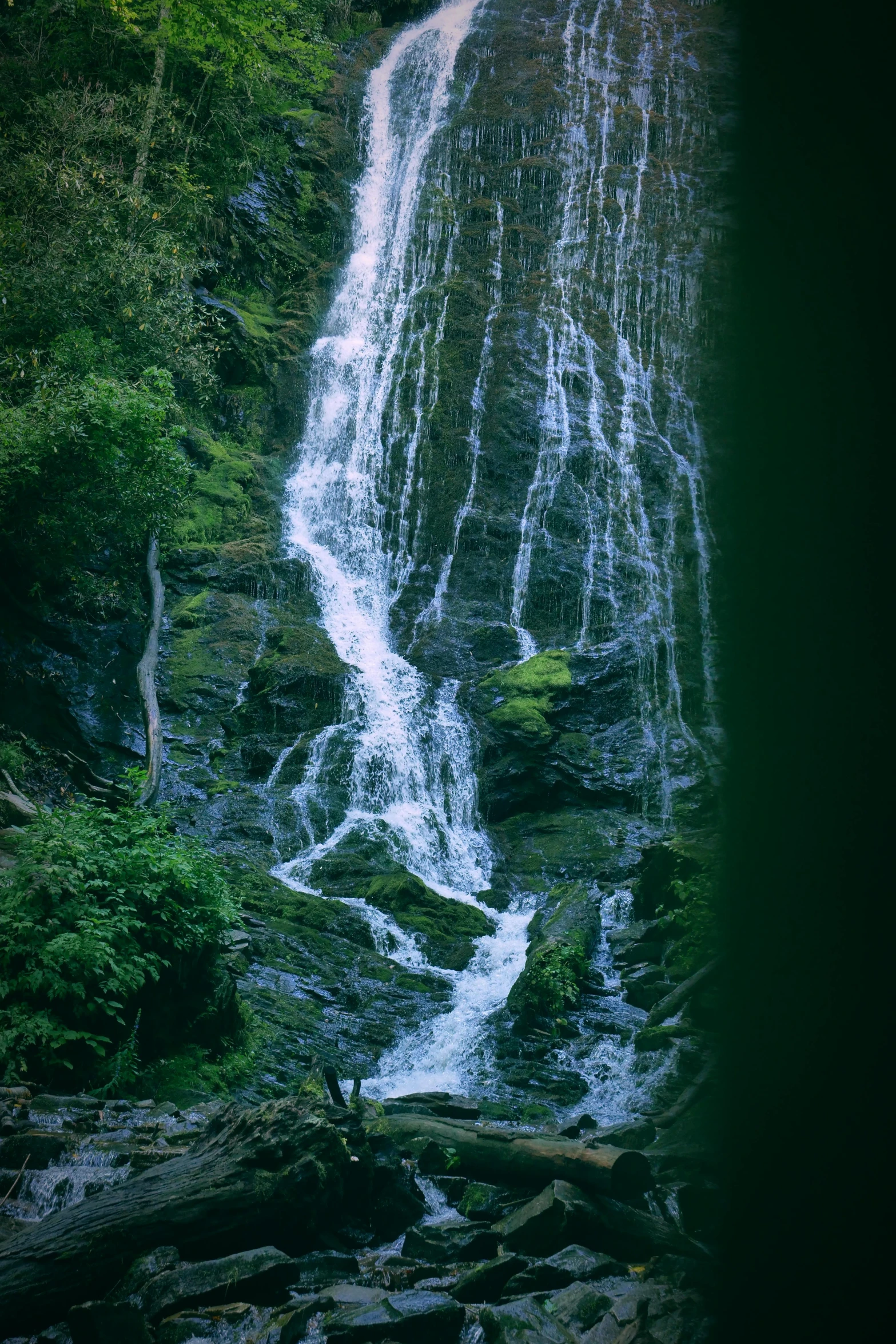 a waterfall that is falling into the water