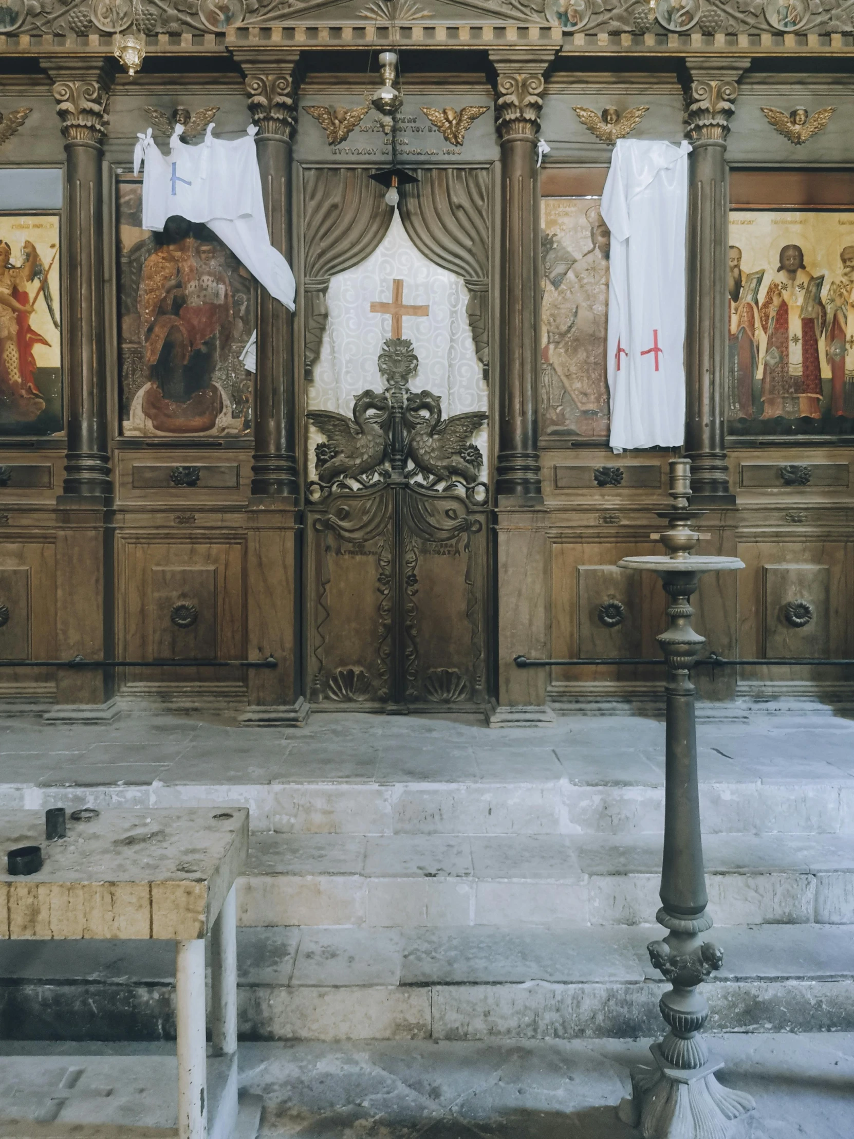 a wooden altar with paintings on it and statues