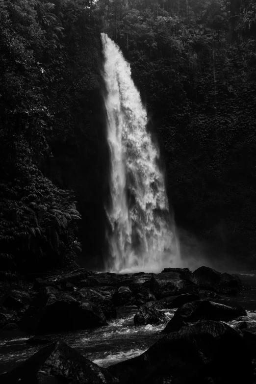 the water pouring over the edge of a rocky cliff