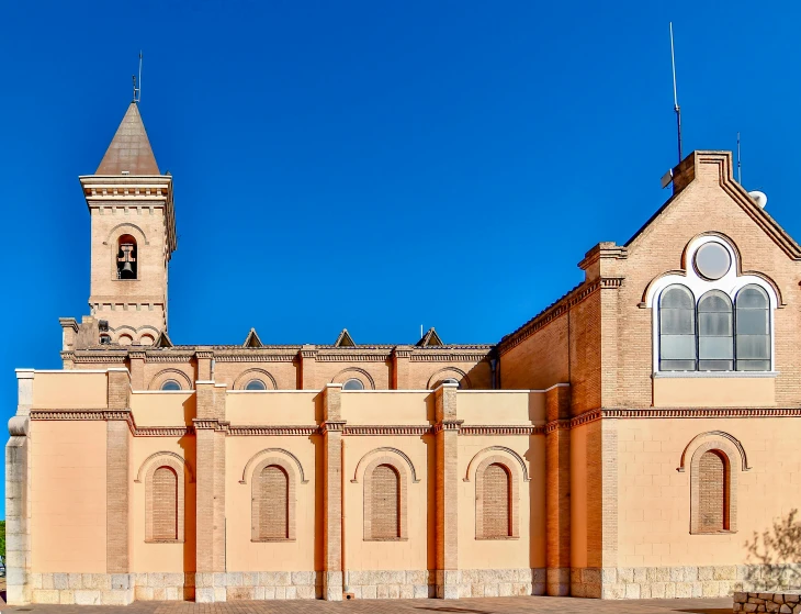 a big building with a steeple with a clock