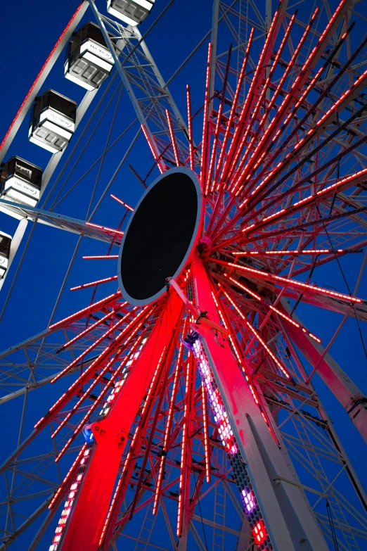 a ferris wheel with colorful lights spinning