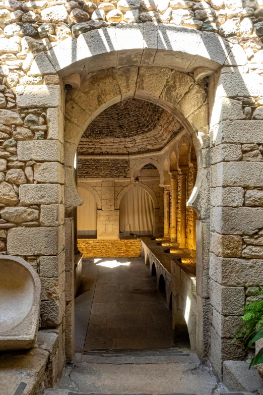 a very narrow building with an arched entry way