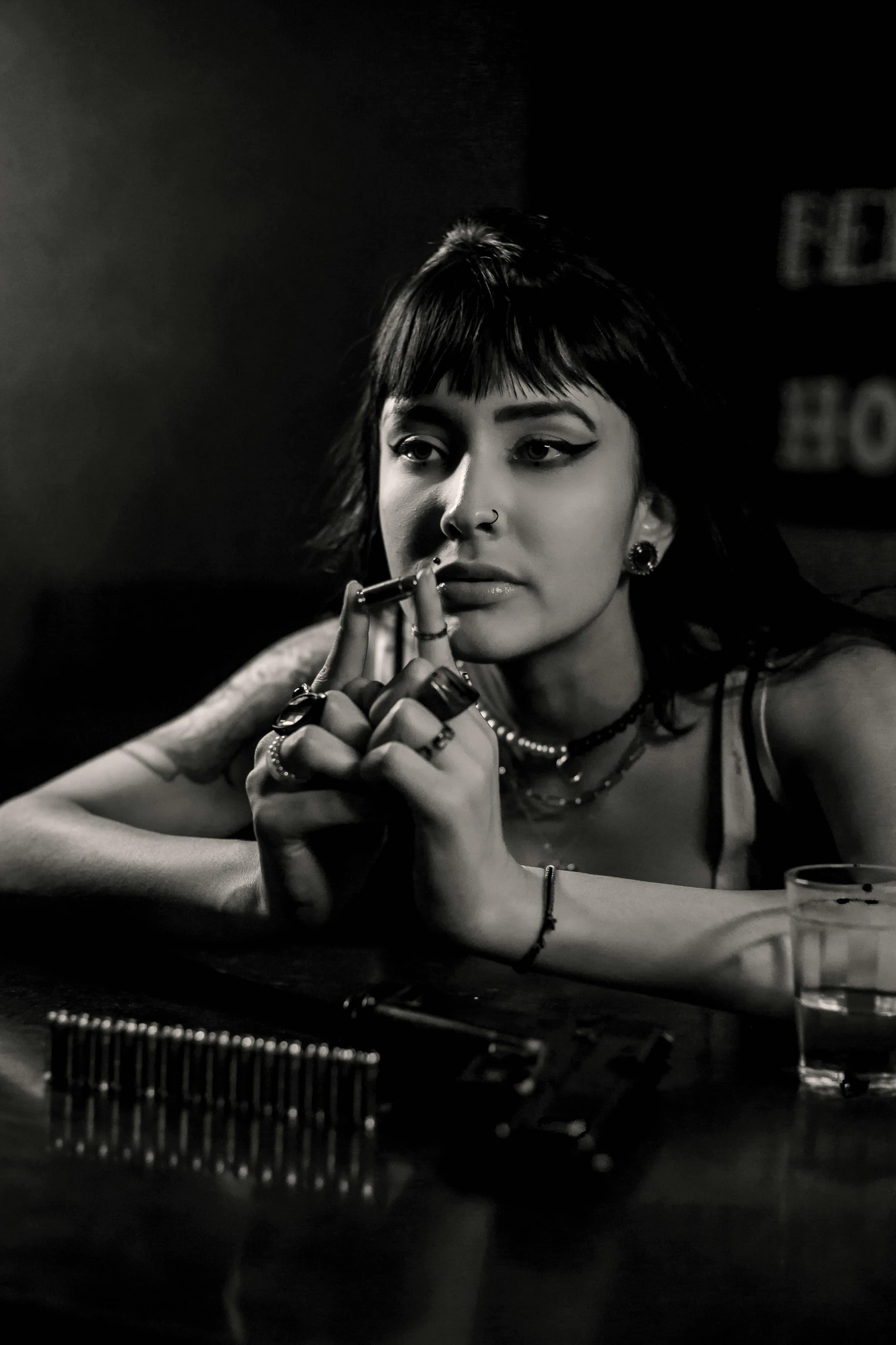 black and white pograph of a woman smoking a cigarette