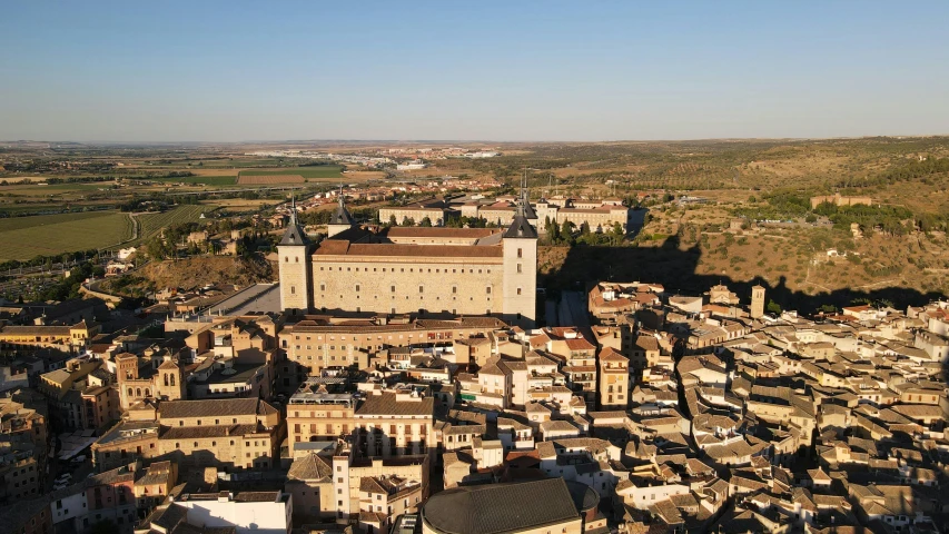 an aerial view of city with buildings near by