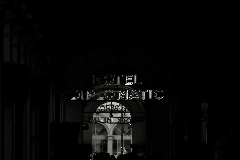 the arch above the door to a building is illuminated in white lights