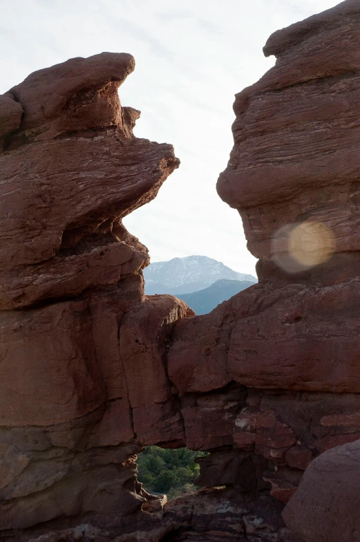 a rock structure is in the middle of the desert