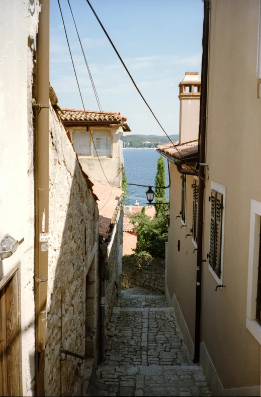 an alleyway going into a city on the river