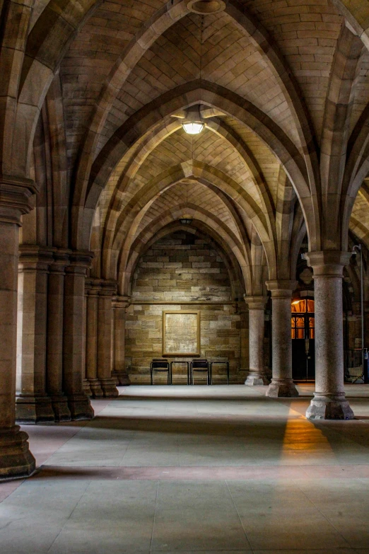 an image of inside a building with multiple pillars