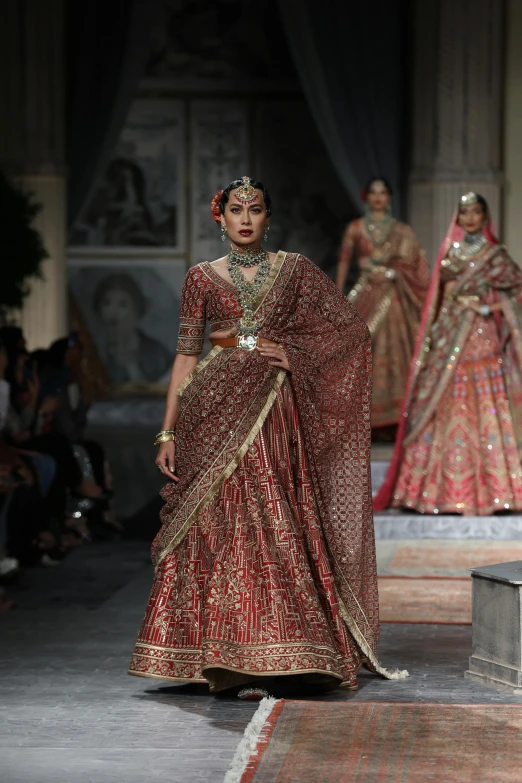 a model presents a creation in indian style