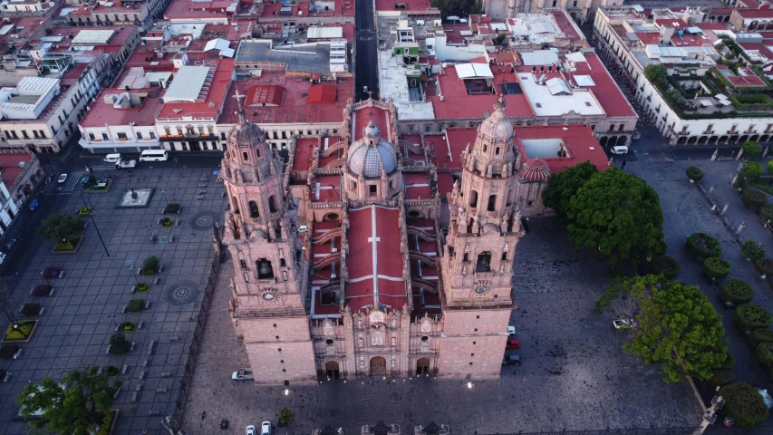 an aerial view of a large cathedral with multiple towers