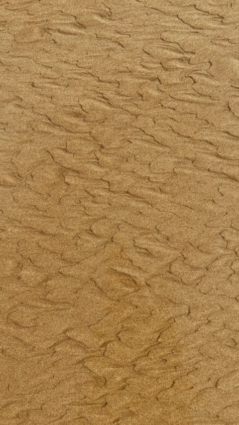 the surface of sand that is brown