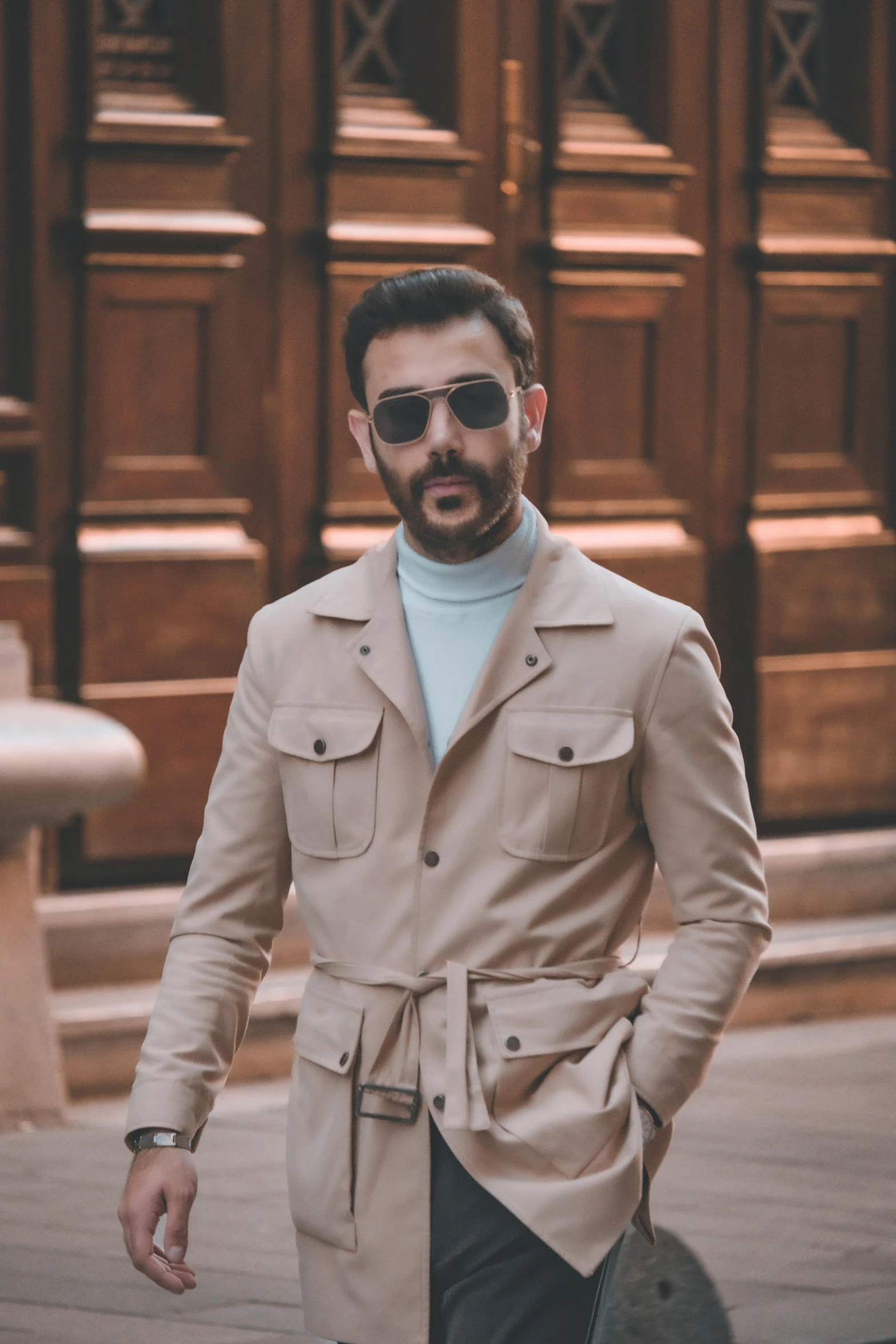 a man with a beard walking down the street