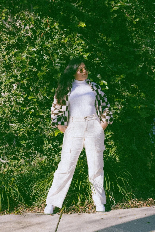 a woman standing on the sidewalk with her legs stretched out