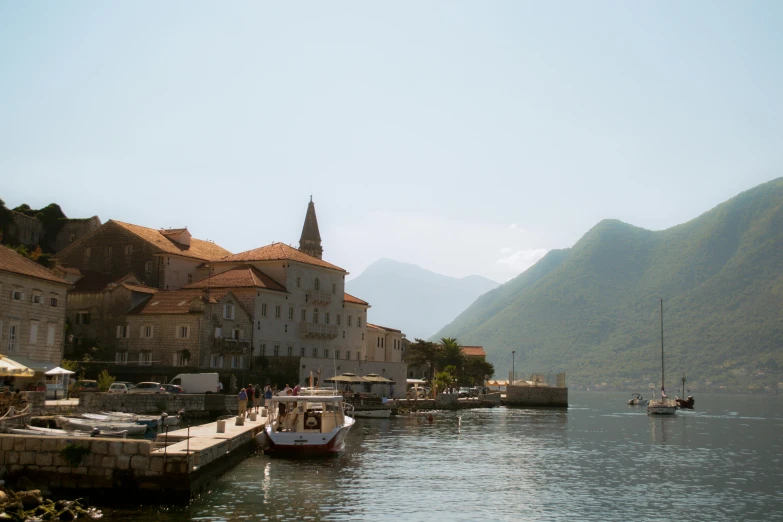 a group of sailboats floating down a body of water