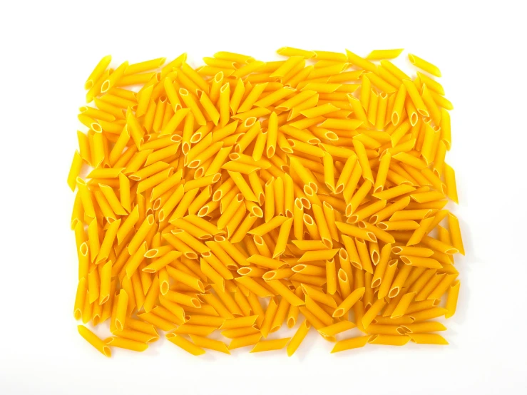 close up of a lot of yellow pasta pieces