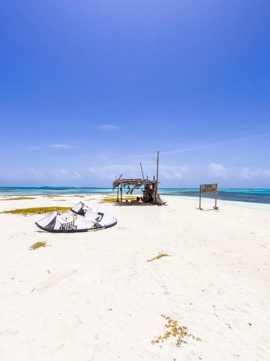 a boat laying on the beach at low tide