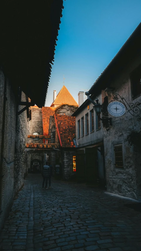 an old building with two buildings behind it