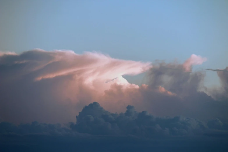 a bunch of clouds that are in the sky